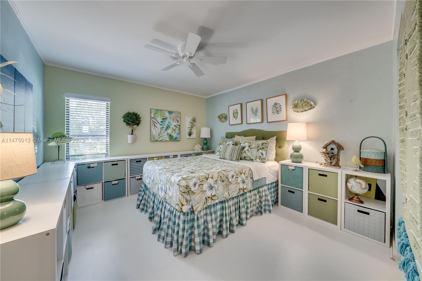 950 Mockingbird Lane, Unit 609A Plantation, FL 33324 - Photo 8 of 64 a bedroom with a bed and a large window with the outer view