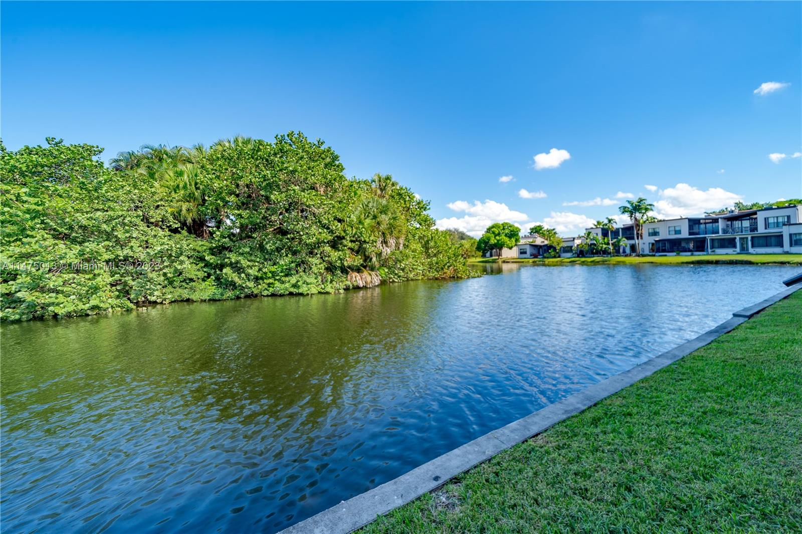 950 Mockingbird Lane, Unit 609A Plantation, FL 33324 - Photo 10 of 64 a view of a lake with houses in the back