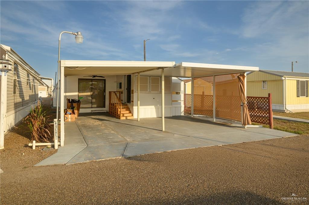 215 South Valley View Road, Unit 227 Donna, TX 78537 - Photo 1 of 18 a view of a house with a outdoor space