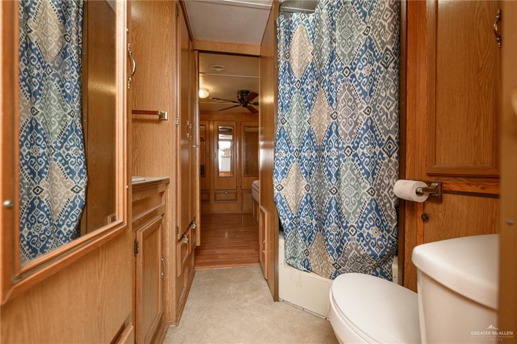 215 South Valley View Road, Unit 227 Donna, TX 78537 - Photo 12 of 18 a bathroom with a toilet and shower