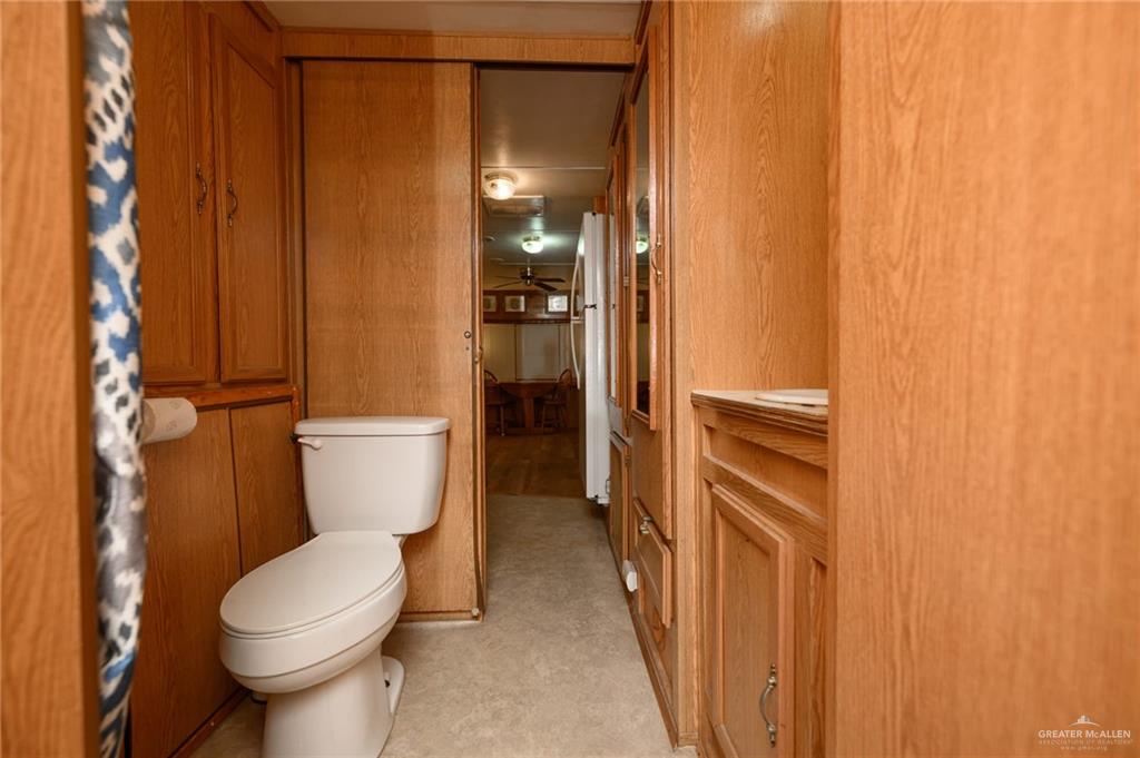 215 South Valley View Road, Unit 227 Donna, TX 78537 - Photo 13 of 18 a bathroom with a toilet and a shower