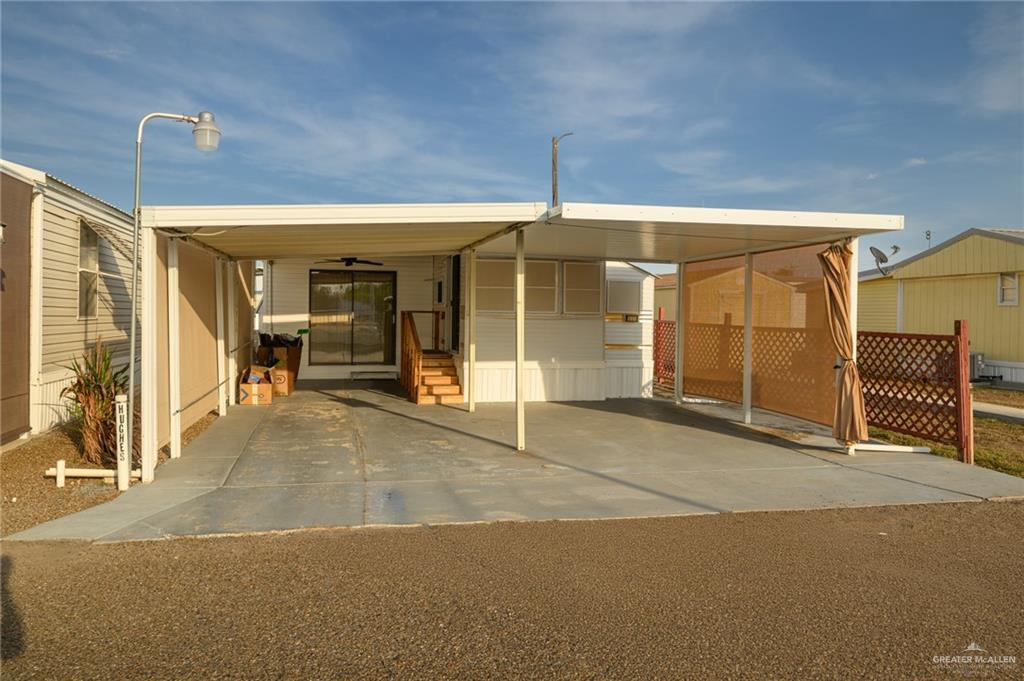 215 South Valley View Road, Unit 227 Donna, TX 78537 - Photo 17 of 18 a view of a building with glass door