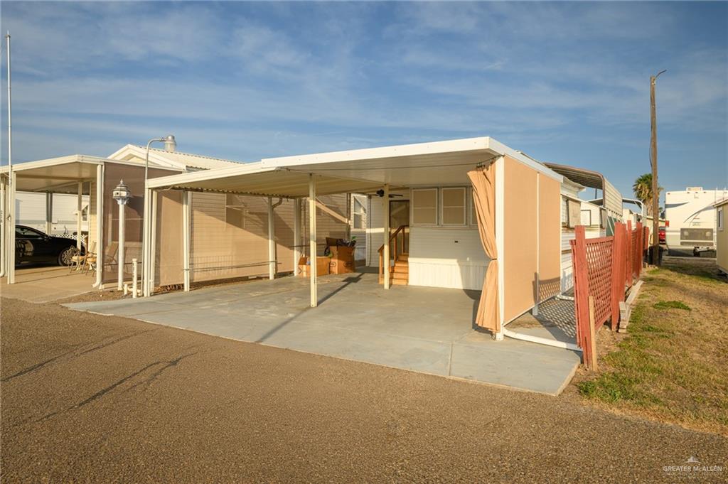 215 South Valley View Road, Unit 227 Donna, TX 78537 - Photo 18 of 18 a view of a house with a outdoor space
