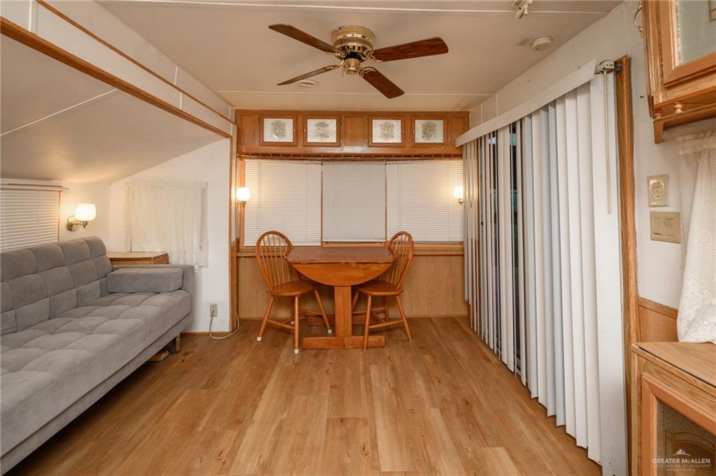 215 South Valley View Road, Unit 227 Donna, TX 78537 - Photo 3 of 18 a view of a livingroom with furniture and a ceiling fan