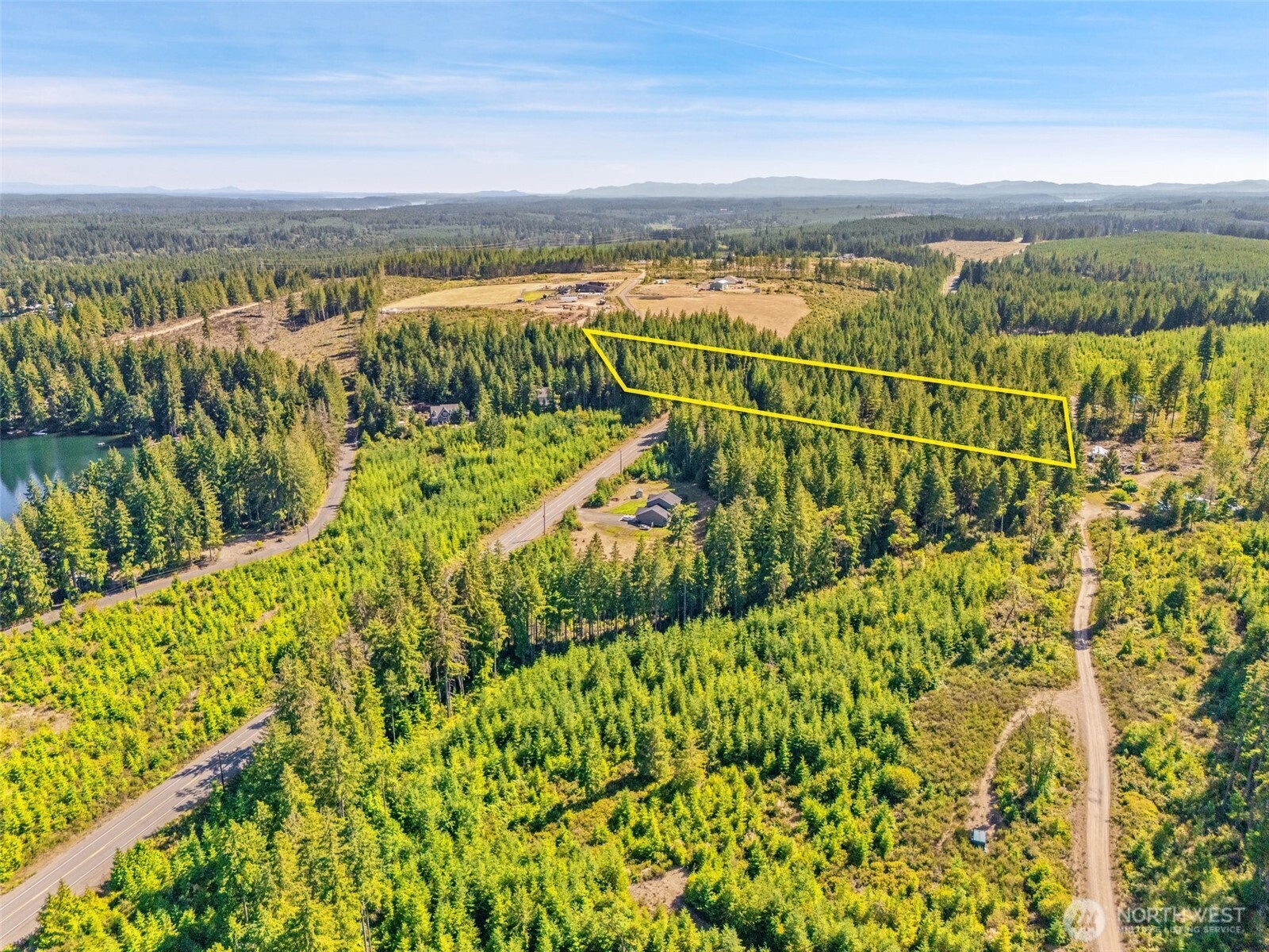3 East Mason Lake Road Grapeview, WA 98546 - Photo 5 of 11 a view of a yard with an outdoor seating