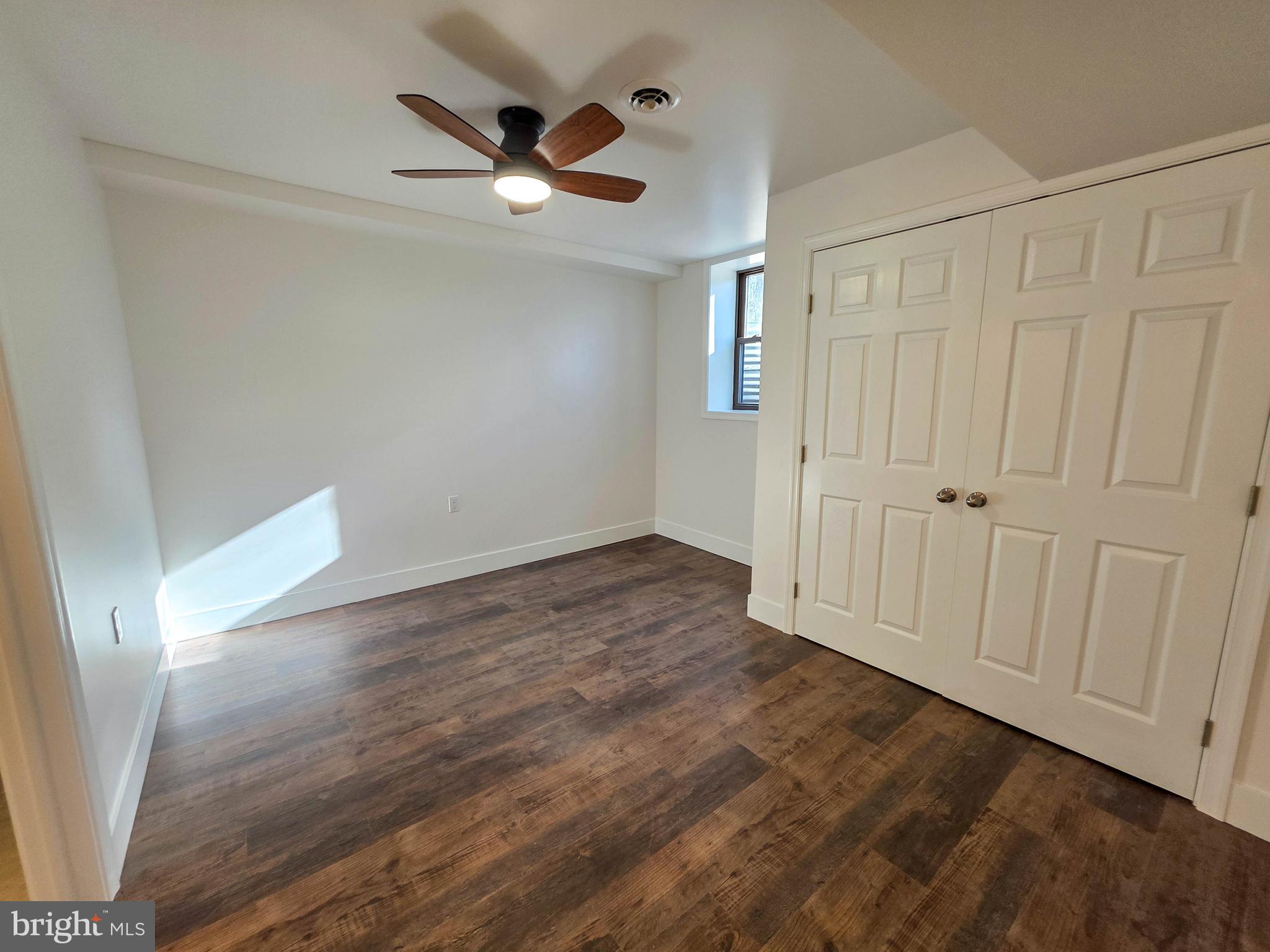 1700 McDowell Road Greencastle, PA 17225 - Photo 17 of 40 an empty room with wooden floor and windows