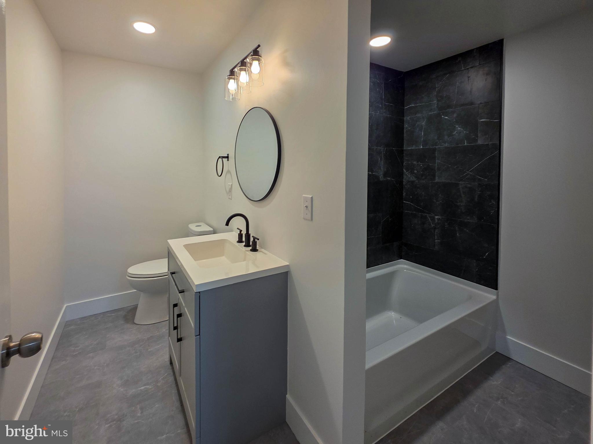 1700 McDowell Road Greencastle, PA 17225 - Photo 18 of 40 a bathroom with a sink a toilet and shower