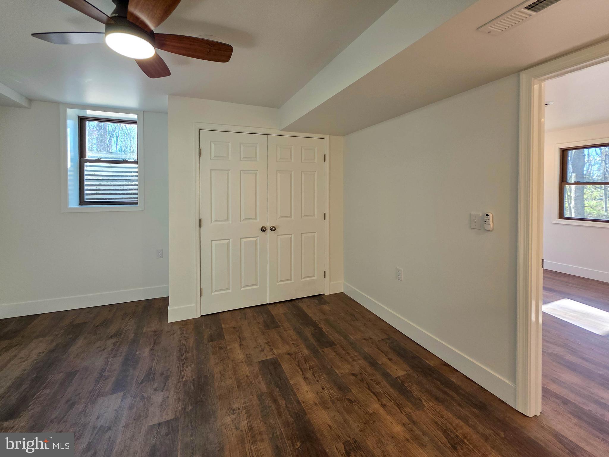 1700 McDowell Road Greencastle, PA 17225 - Photo 19 of 40 a view of an empty room with wooden floor and a window