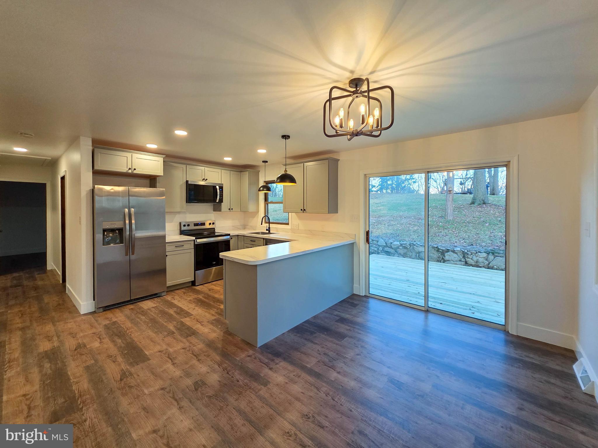 1700 McDowell Road Greencastle, PA 17225 - Photo 2 of 40 a large kitchen with a large counter top appliances and cabinets