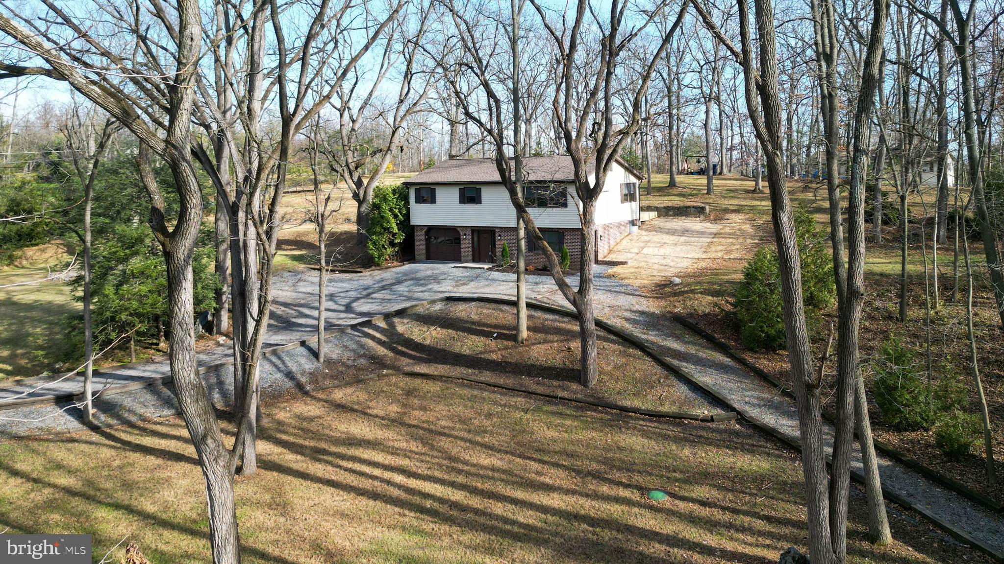 1700 McDowell Road Greencastle, PA 17225 - Photo 26 of 40 a view of a house with backyard and trees