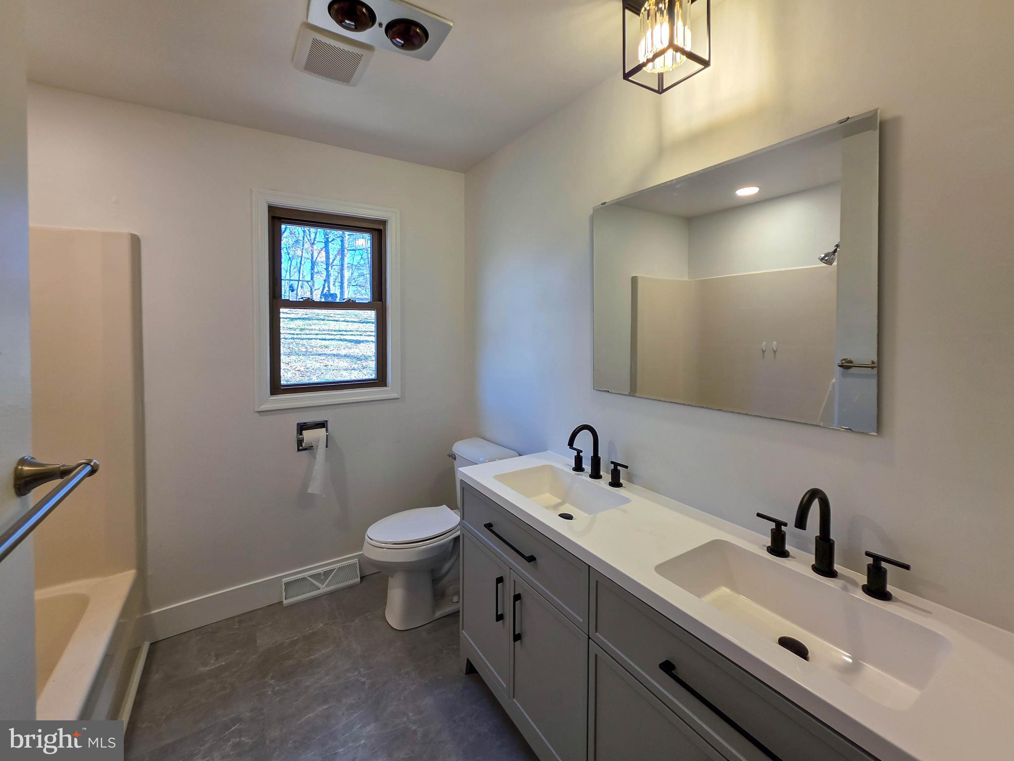 1700 McDowell Road Greencastle, PA 17225 - Photo 6 of 40 a bathroom with a toilet sink and mirror