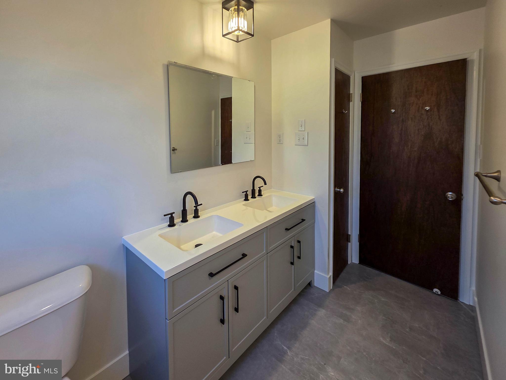 1700 McDowell Road Greencastle, PA 17225 - Photo 7 of 40 a bathroom with a double vanity sink and mirror