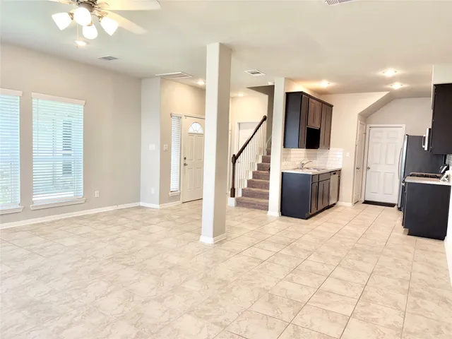 a view of kitchen with furniture and flat screen tv