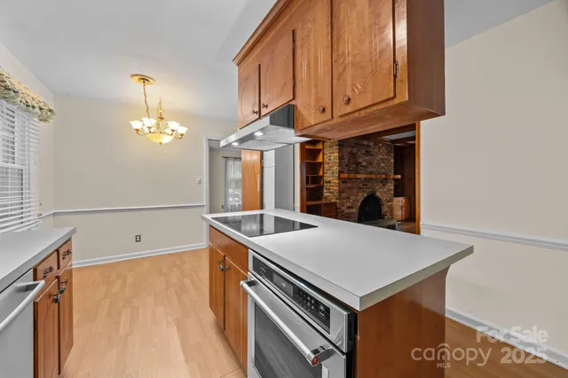 a kitchen that has a cabinets a sink and a stove
