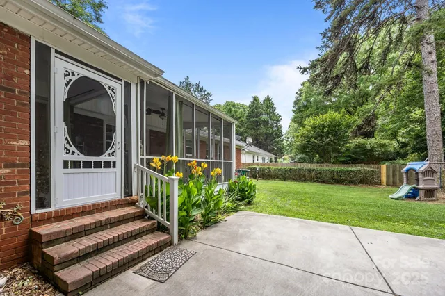 a view of a garden with wooden fence