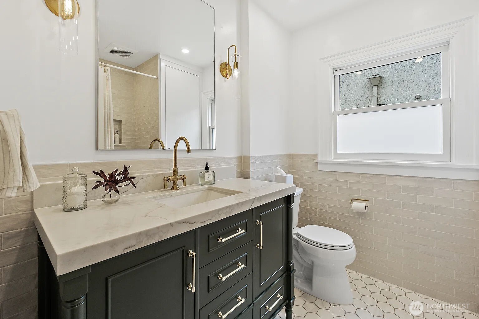 1114 North 77th Street Seattle, WA 98103 - Photo 11 of 30 a bathroom with a toilet sink and mirror