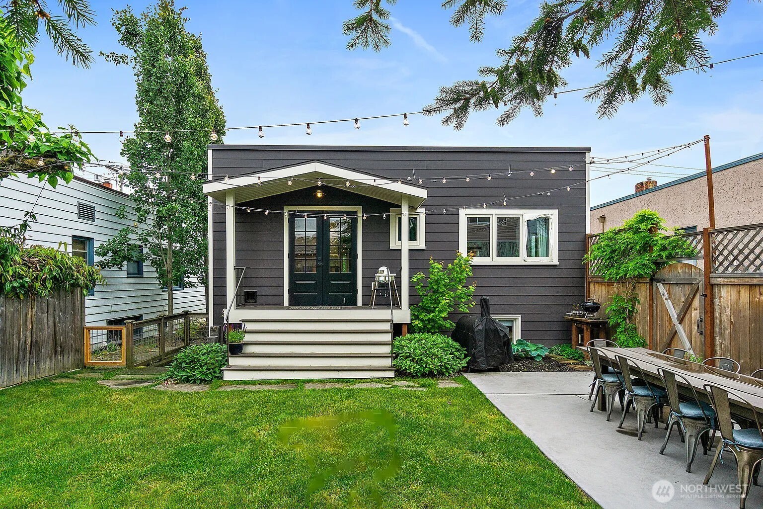 1114 North 77th Street Seattle, WA 98103 - Photo 15 of 30 a front view of a house with a yard