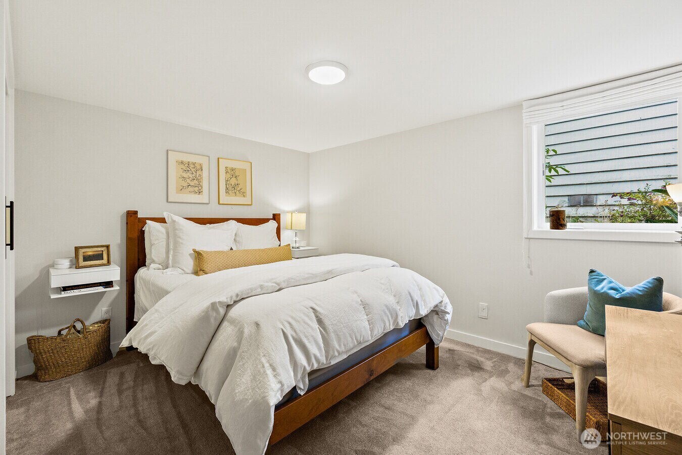 1114 North 77th Street Seattle, WA 98103 - Photo 25 of 30 a bedroom with a bed and a window