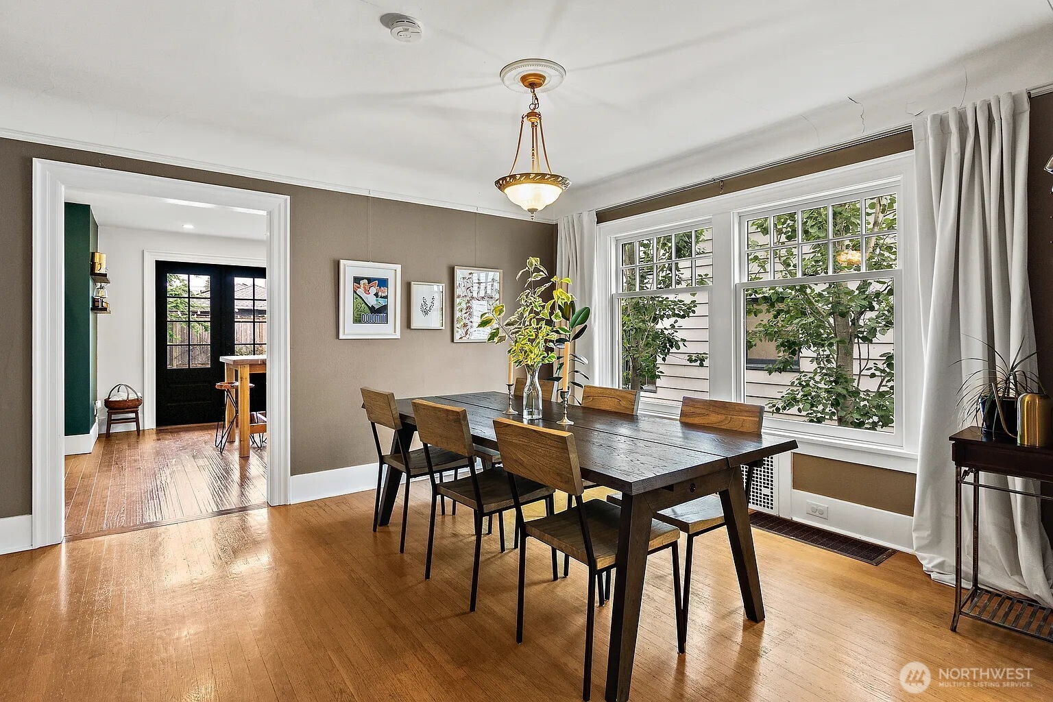 1114 North 77th Street Seattle, WA 98103 - Photo 5 of 30 a view of a dining room with furniture window and wooden floor