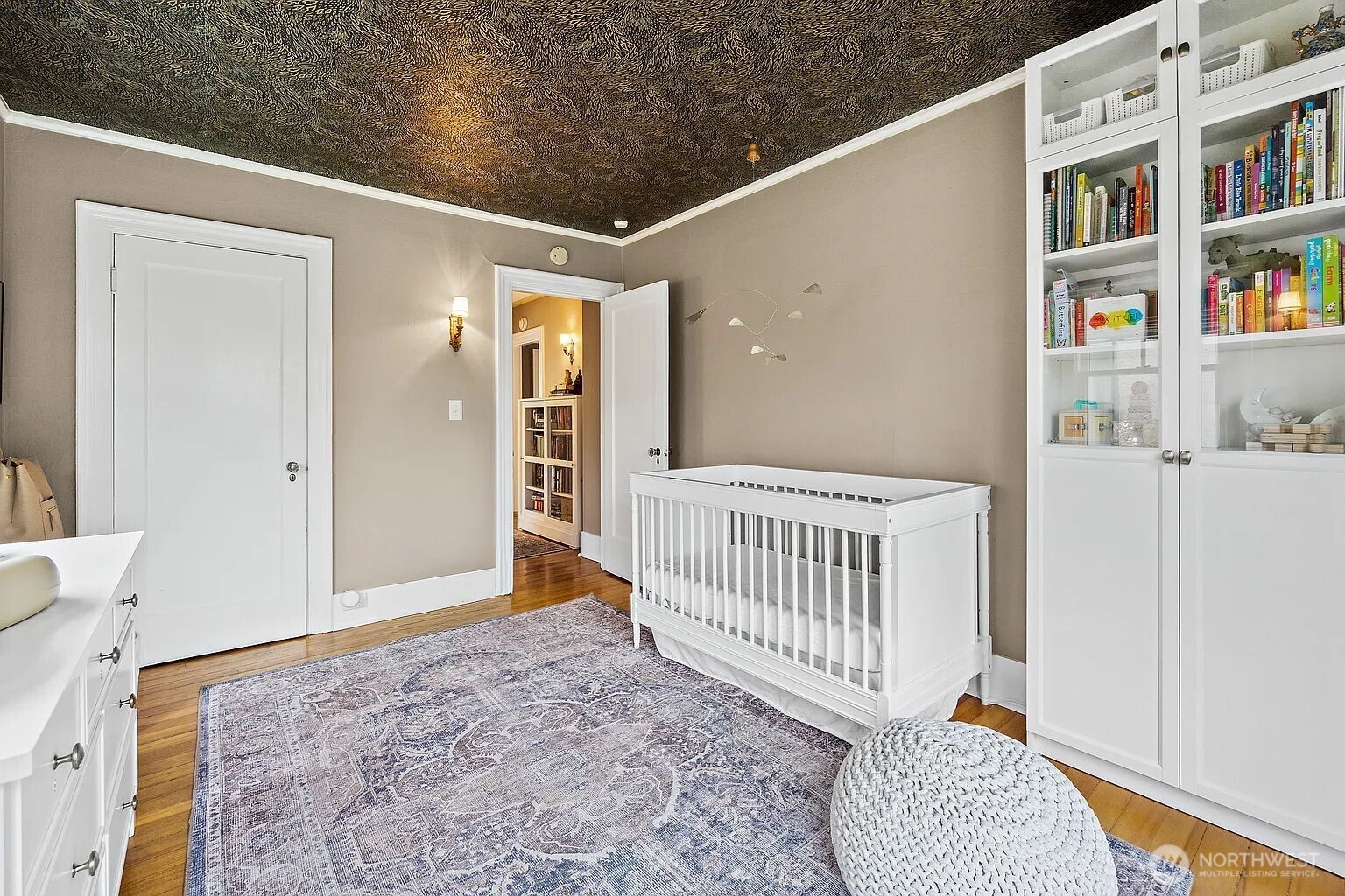 1114 North 77th Street Seattle, WA 98103 - Photo 10 of 30 a view of a bedroom with furniture and book shelf