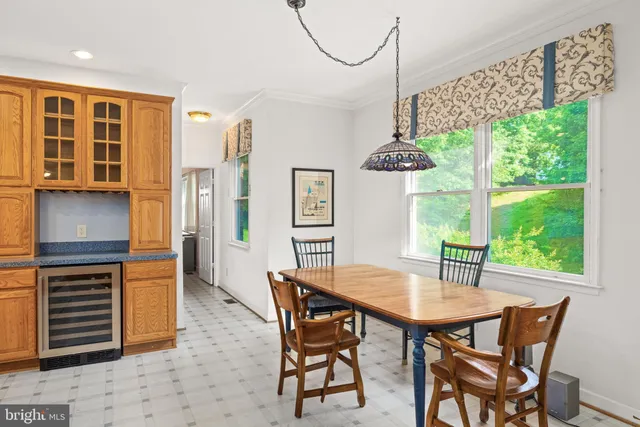 a dining room with furniture and window