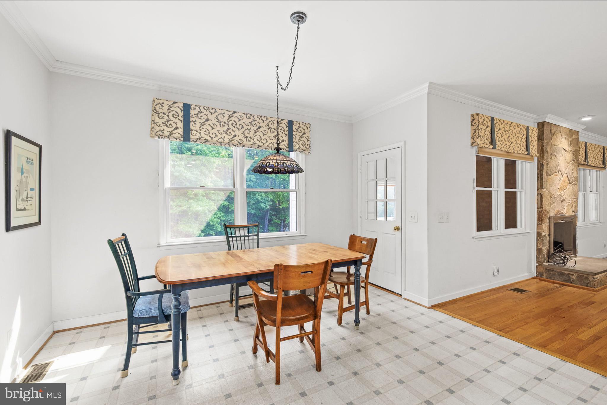 10 Piper Place Fredericksburg, VA 22405 - Photo 16 of 34 a dining room with furniture a chandelier and wooden floor