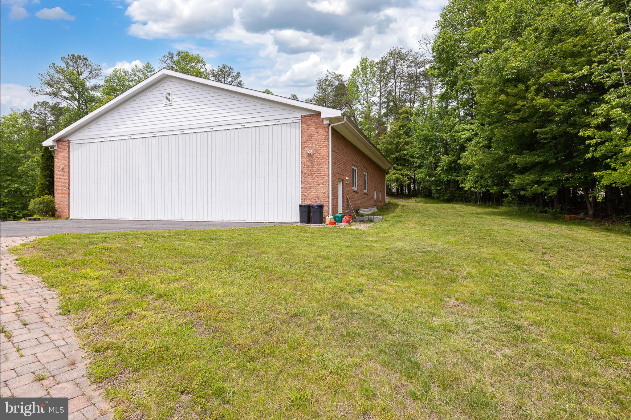 10 Piper Place Fredericksburg, VA 22405 - Photo 33 of 34 a view of a house with a yard and garage