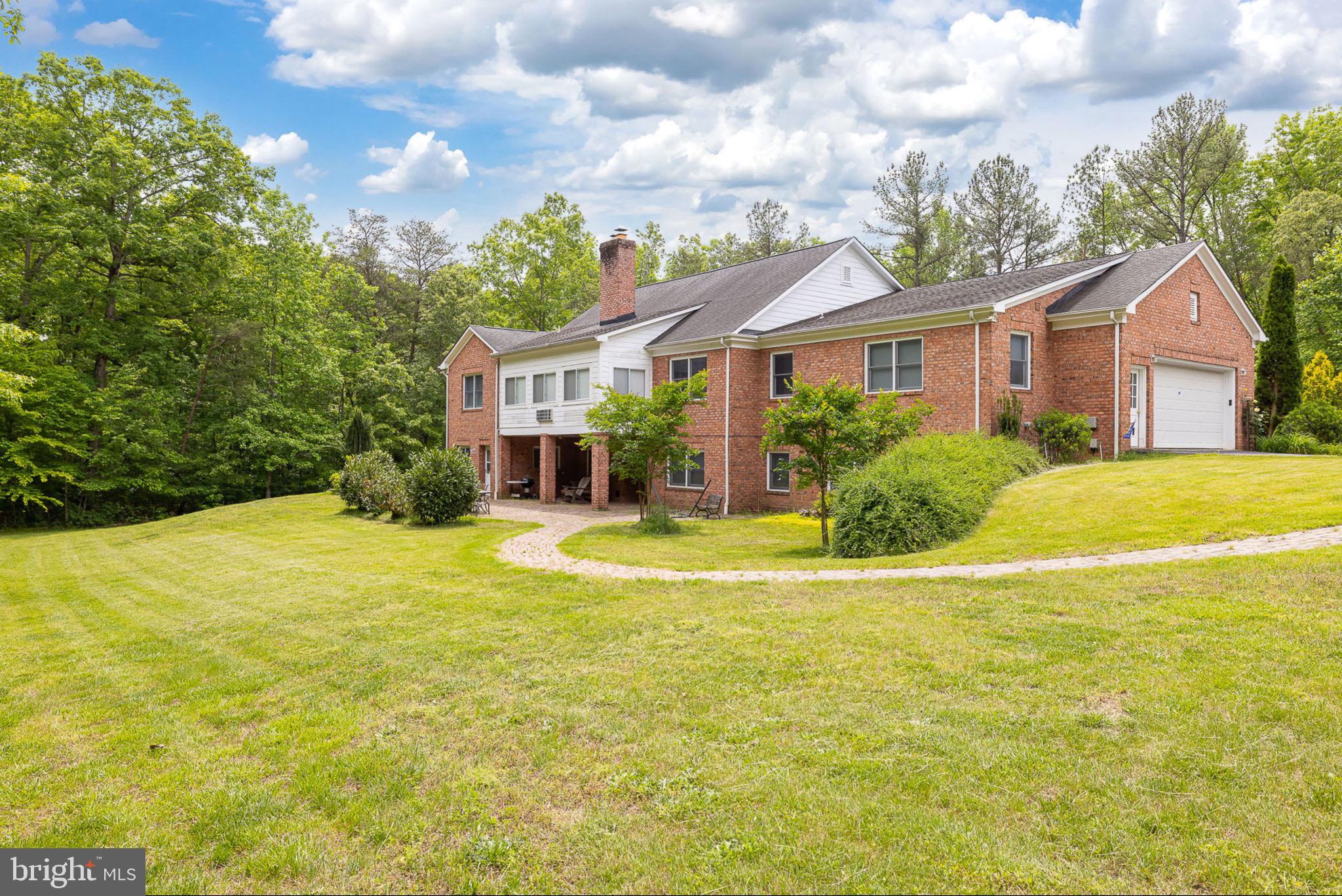 10 Piper Place Fredericksburg, VA 22405 - Photo 4 of 34 a view of a house with a backyard and a tree