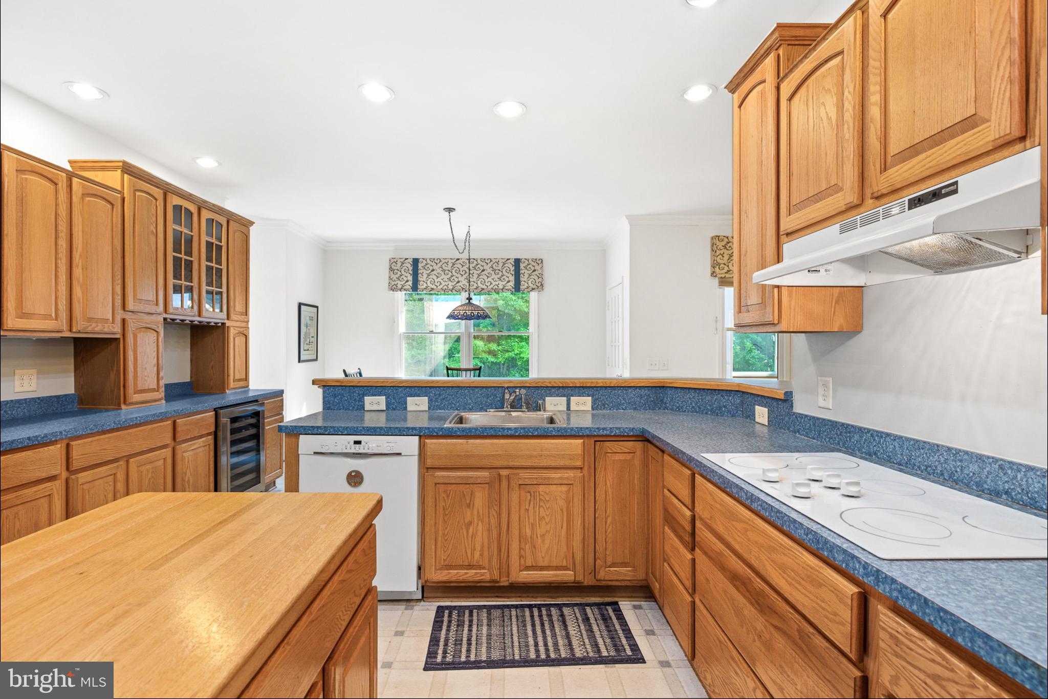 10 Piper Place Fredericksburg, VA 22405 - Photo 8 of 34 a kitchen with stainless steel appliances a sink stove and cabinets
