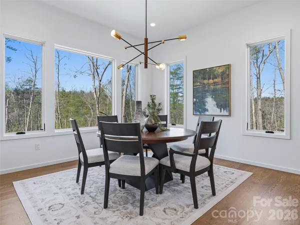 a view of a dining room with furniture window and outside view