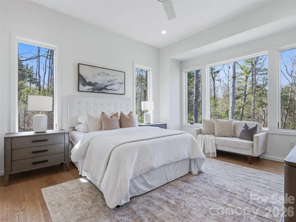 a bedroom with a large bed and a couch