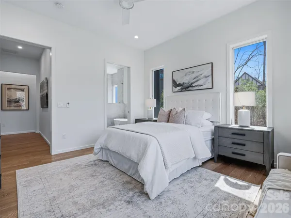 a bedroom with bed and window