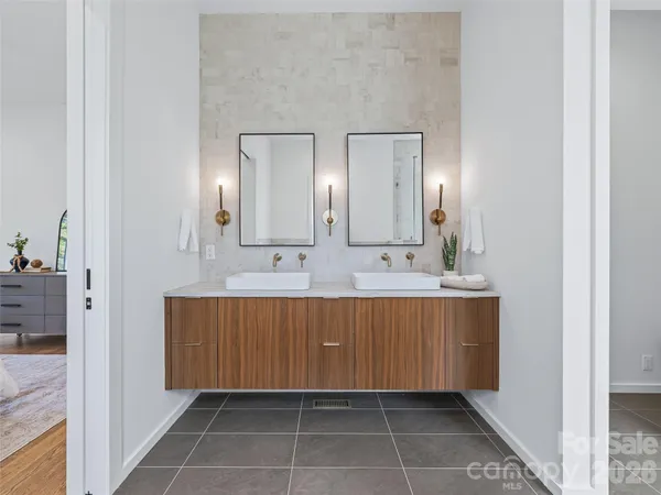 a bathroom with a sink a mirror and a bathtub