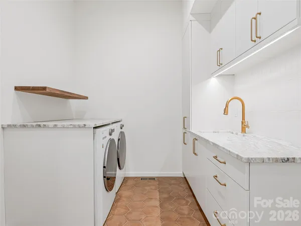 a bathroom with a sink and mirror
