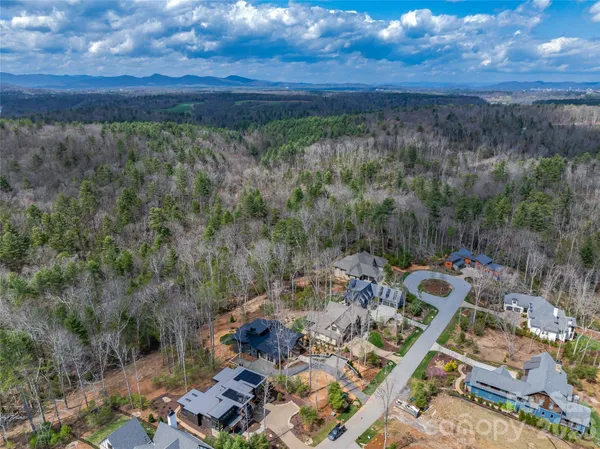 a view of a backyard of a house with a yard