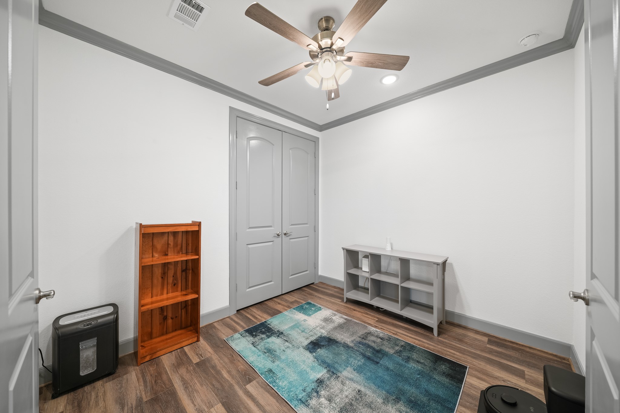 5739 Bobwhite Trail Manvel, TX 77578 - Photo 13 of 29 A versatile secondary room offers the flexibility to serve as a home office, exercise room or hobby space. Crown molding and recessed lighting add a polished finishing touch.
