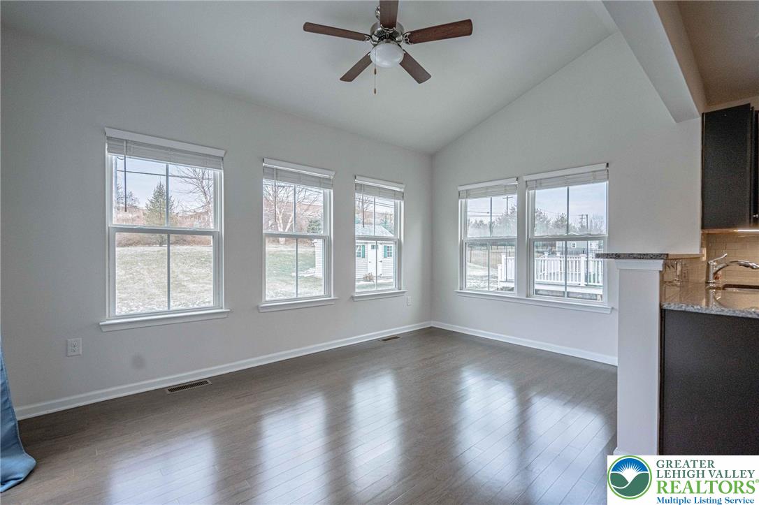 2584 Raya Way Easton, PA 18045 - Photo 17 of 50 a view of an empty room with wooden floor and a window