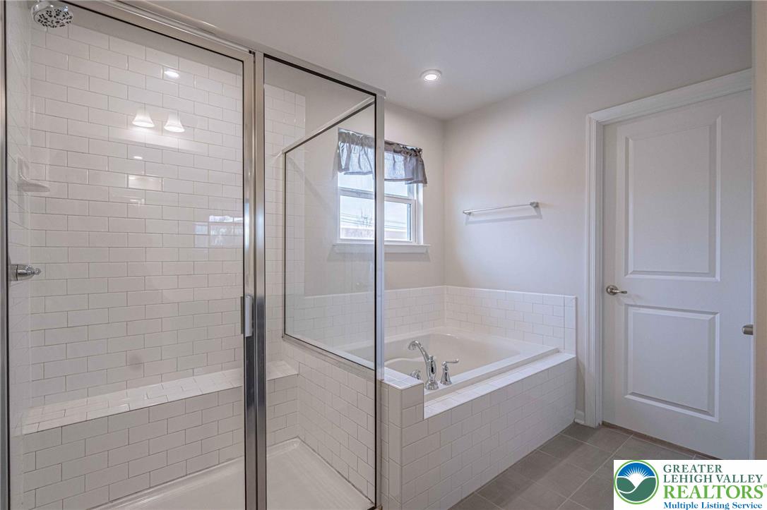 2584 Raya Way Easton, PA 18045 - Photo 36 of 50 a bathroom with a bathtub and a shower