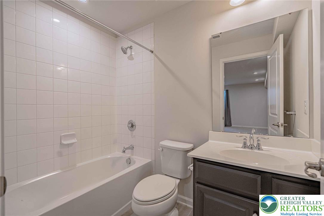 2584 Raya Way Easton, PA 18045 - Photo 41 of 50 a bathroom with a sink a toilet and shower