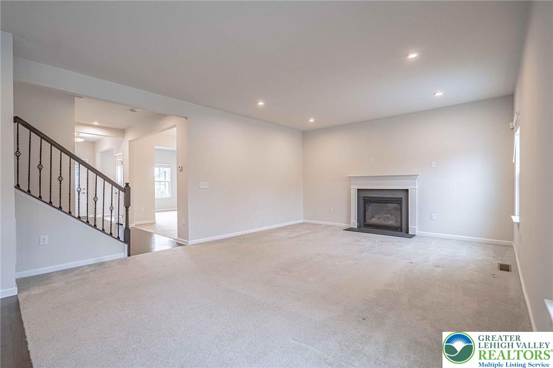 2584 Raya Way Easton, PA 18045 - Photo 10 of 50 a view of an empty room with a fireplace