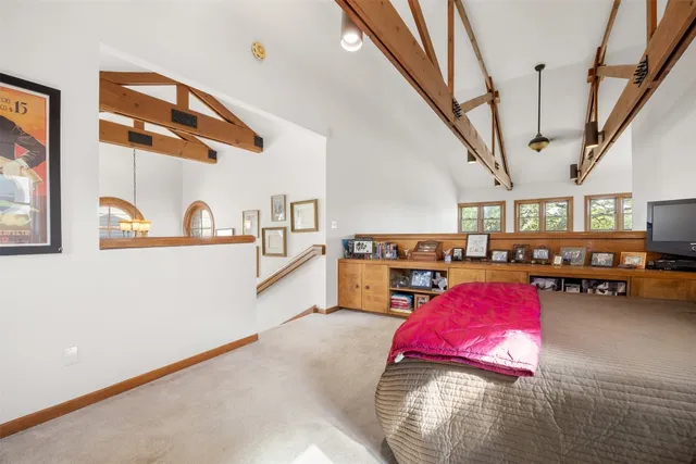 a bed room with furniture and a window