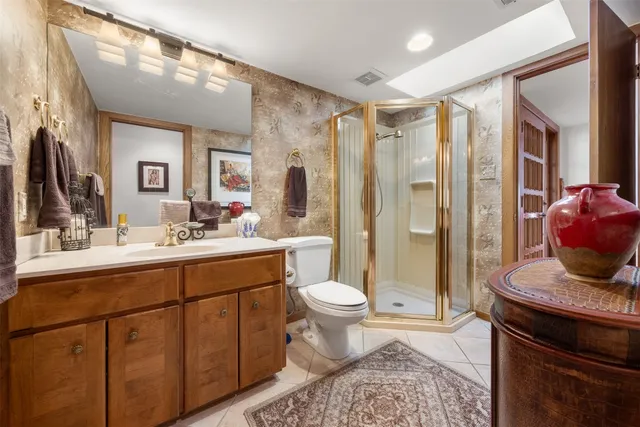 a house view with swimming pool and trees in the background