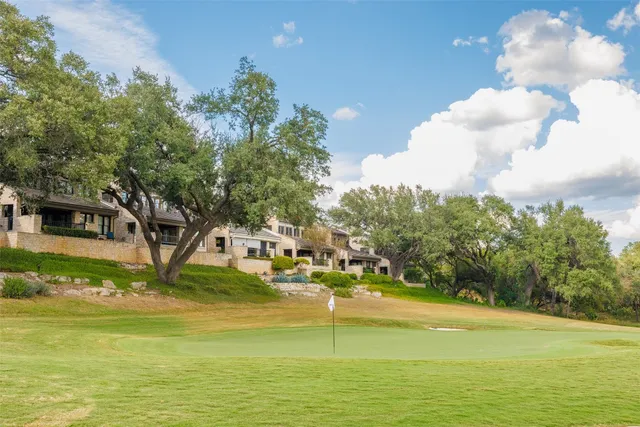 a view of a swimming pool with an outdoor space and seating area