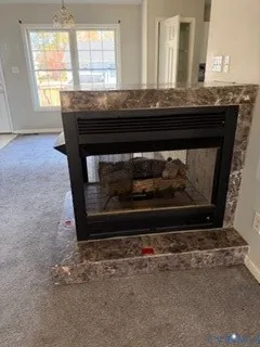 a room with fireplace and wooden floor