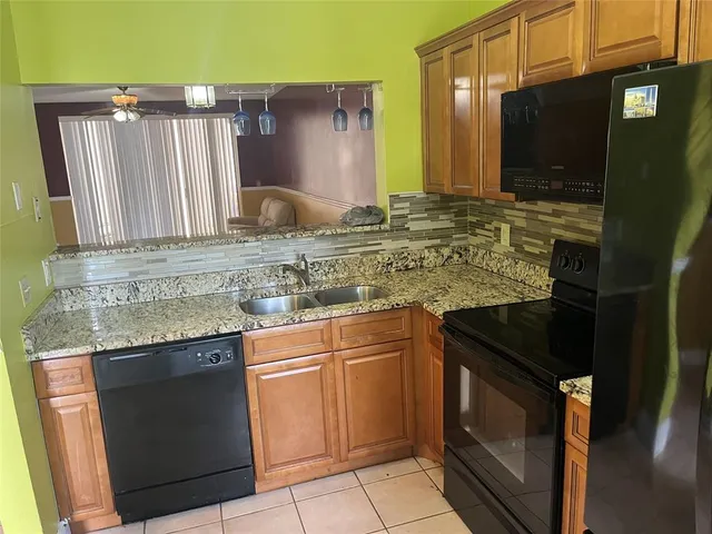 a kitchen with a sink and a microwave