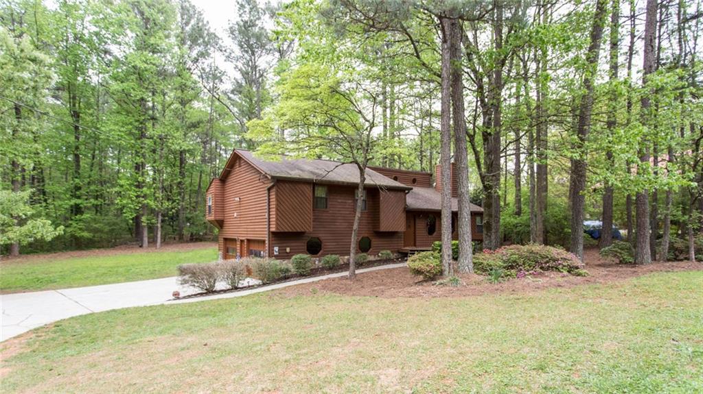 488 Tom Smith Road Southwest Lilburn, GA 30047 - Photo 1 of 1 Welcome home to beautiful home on large level lot