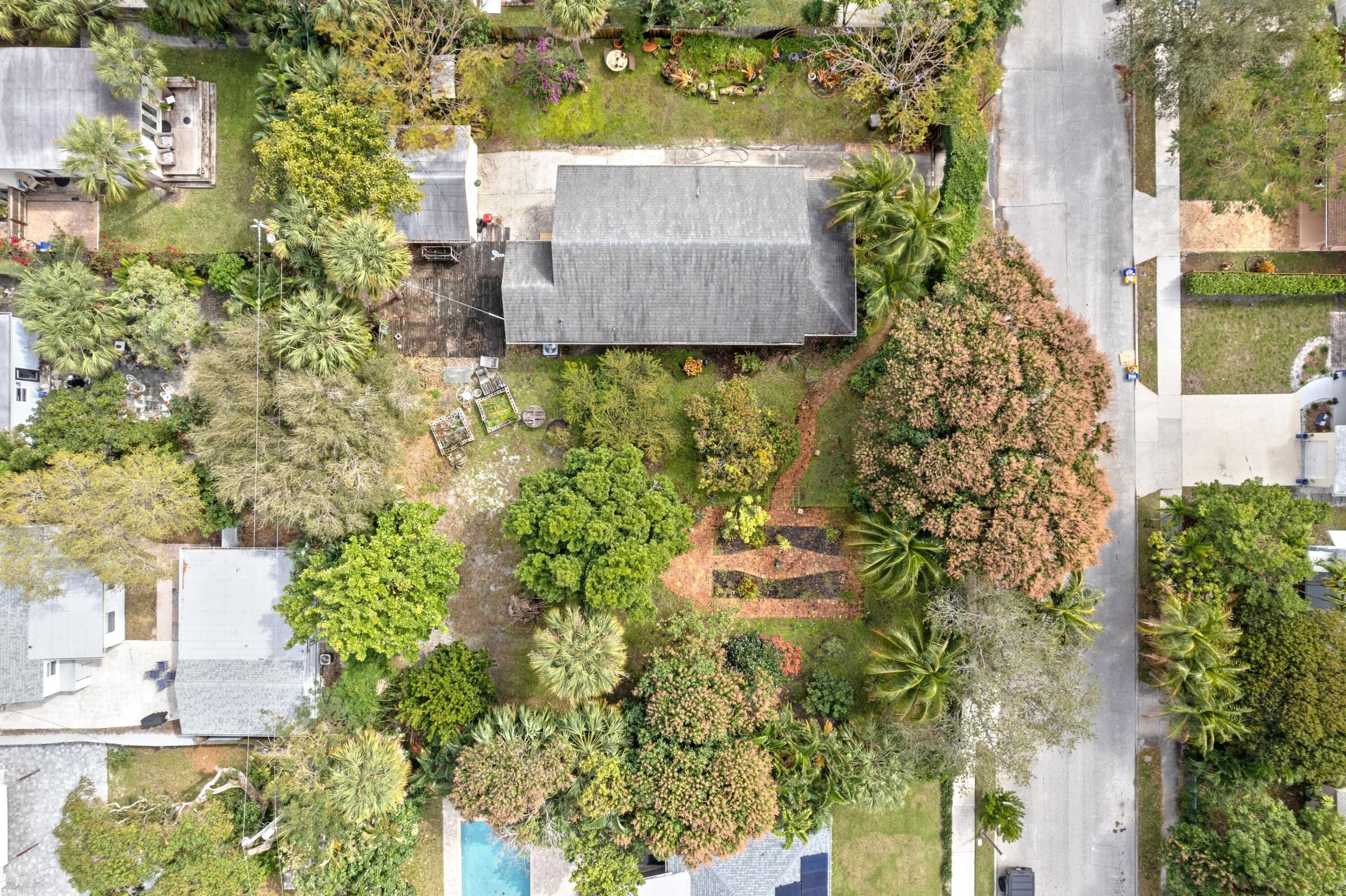 913 Sunset Road West Palm Beach, FL 33401 - Photo 6 of 12 an aerial view of a house with a yard and garden
