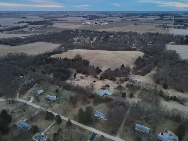 a view of a yard with a tree