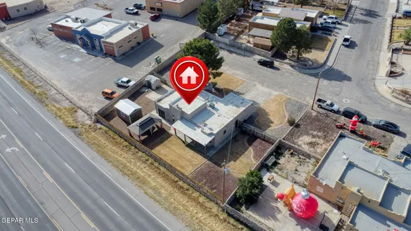 an aerial view of a residential apartment building with a yard