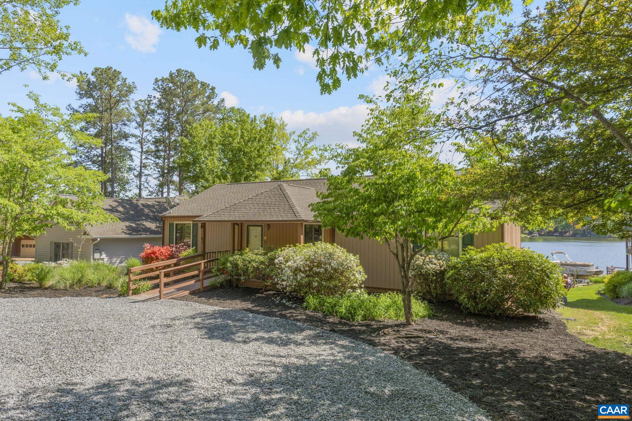 43 Tanglewood Road Palmyra, VA 22963 - Photo 2 of 64 a front view of a house with a yard and a street
